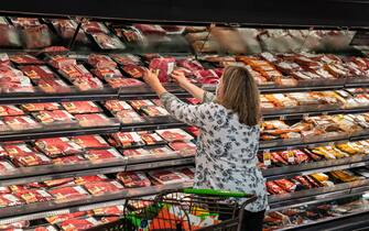 SOUTH BURLINGTON, VERMONT - JUNE 20: A shopper looks at a meat display June 20, 2022 at the Market 32 Supermarket in South Burlington, Vermont. In March of 2022, meat prices were 20% higher than they were in 2021.  (Photo by Robert Nickelsberg/Getty Images)