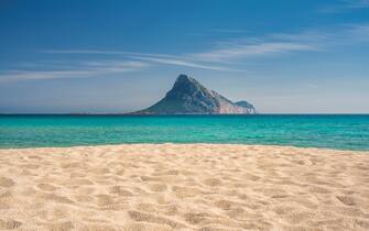 The beach of Porto Taverna with Tavolara Island - North-eastern Sardinia, Italy