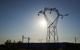 A high voltage pylon is pictured during an heatwave. The current drought and heatwave in France (as elsewhere in Europe) put the french national grid under strains. The lack of water pushed French authorities to exempt nuclear power plants of duties. For exemple, no water should be released at more than 28°C in rivers after cooling nuclear reactors, but, as the Garonne river temperature reaches 29°C, the french government authorizes the Golfech nuclear plant (amid other) to release water at a maximun of 31.3°C in the Garonne river. The French goverment says it's necessary to avoid a black out. Toulouse. France. July 22th 2022. (Photo by Alain Pitton/NurPhoto)