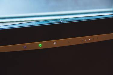 Home internet wifi router and backlit indicators, closeup