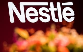 epa09018170 (FILE) - The Nestle logo is pictured during the general meeting of the world's biggest food and beverage company, Nestle Group, in Lausanne, Switzerland, 11 April 2019 (reissued 17 February 2021). Nestle is due to release its 2020 full-year results on 18 February 2021.  EPA/JEAN-CHRISTOPHE BOTT *** Local Caption *** 55118423