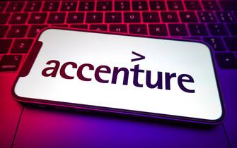 CHINA - 2022/08/20: In this photo illustration, the Accenture logo is displayed on the screen of a smartphone. (Photo Illustration by Sheldon Cooper/SOPA Images/LightRocket via Getty Images)