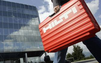 TO GO WITH AFP STORY BY ANDRE LEHMANN  An Hilti employee arrives at the Hilti headquarters on August 14, 2009 in Schaan, Liechtenstein. Hilti produces construction tools and applications since 1941 and employes more than 20 000 people in the world. AFP PHOTO /  Nicholas Ratzenboeck (Photo credit should read NICHOLAS RATZENBOECK/AFP via Getty Images)