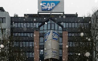 epa08968028 An exterior view of building 'Number 1' during a snow shower at the headquarters of SAP in Walldorf, Germany, 27 January 2021. Software producer SAP SE will release their preliminary business figures for the fourth quarter Q4 and the full year 2020 on 29 January 2021.  EPA/RONALD WITTEK
