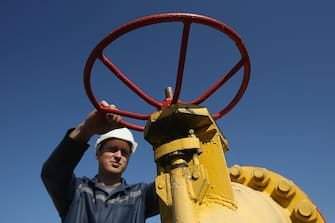 DASHAVA, UKRAINE - SEPTEMBER 18:  A worker, at the request of the photographer, grasps a hand wheel on a valve at the Dashava natural gas facility on September 18, 2014 in Dashava, Ukraine. The Dashava facility, which is both an underground storage site for natural gas and an important transit station along the natural gas pipelines linking Russia, Ukraine and eastern and western Europe, is operated by Ukrtransgaz, a subsidiary of Ukrainian energy company NJSC Naftogaz of Ukraine. Ukraine recently began importing natural gas from Slovakia through Dashava as Ukraine struggles to cope with cuts in gas deliveries by Gazprom of Russia. As Russia has cut supplies many countries in Europe that rely heavily on Russian gas fear that Russia will increasingly use gas delivery cuts as a political weapon to counter European economic sanctions arising from Russian involvement in fighting between pro-Russian separatists and Ukrainian armed forces in eastern Ukraine.  (Photo by Sean Gallup/Getty Images)