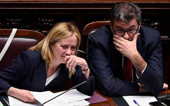 Italian Prime Minister, Giorgia Meloni (L), with Italian Minister of Economy, Giancarlo Giorgetti (R), ahead of a confidence vote for the new government, at the Chamber of Deputies, the lower house of parliament, in Rome, Italy, 25 October 2022. ANSA/RICCARDO ANTIMIANI