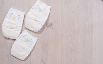 baby diapers on wooden background