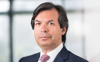 Carlo Messina, chief executive officer of Intesa Sanpaolo SpA, poses for a photograph ahead of a Bloomberg Television interview in London, U.K., on Wednesday, April 2, 2014. Messina said Italy's second-biggest bank is in talks to sell non-strategic assets as part of a four-year plan. Photographer: Simon Dawson/Bloomberg via Getty Images 