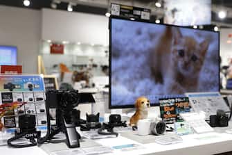 A Sony Group Corp. ZV-E10 interchangeable-lens vlog camera, left, displayed at the company's showroom inside the Ginza Place building in Tokyo, Japan, on Wednesday, Oct. 27, 2021. Sony is scheduled to release its earnings figures on Oct. 28. Photographer: Kiyoshi Ota/Bloomberg via Getty Images