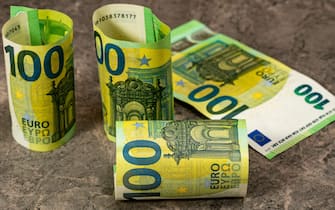 100 euro banknotes on the grey stone background