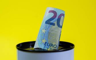 Euro banknotes in a jar. Bills and coins in a piggy bank. Save money. World Financial crisis.