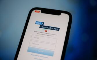 The Silicon Valley Bank (SVB) logo is seen on a phone screen in this photo illustration on 11 March, 2023 in Warsaw, Poland. (Photo by Jaap Arriens/NurPhoto)