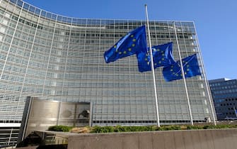 BRUSSELS, BELGIUM - MARCH 01: EU flags are half-mast in tribute of the train crash in Greece in front of the Berlaymont on March 1, 2023 in Brussels, Belgium. At least thirty-six people died in Larissa, Greece, on the night of February 28 to March 1, in the collision between a freight train and a passenger train. (Photo by Thierry Monasse/Getty Images)