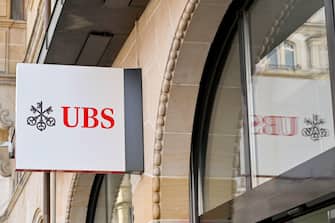 Basel, Switzerland - April 2022: Sign above the entrance to a branch of the UBS Bank in the city centre