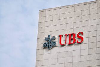 Zug, Switzerland - 26th February 2021 : UBS Bank logo sign hanging on a building facade in Zug. UBS is one of the leading banks in Switzerland and in