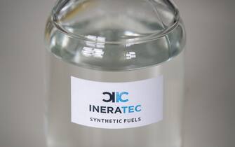 06 May 2019, Baden-Wuerttemberg, Eggenstein-Leopoldshafen: A bottle containing synthetic fuel from Ineratec GmbH is on a table at the Karlsruhe Institute of Technology (KIT). (to dpa-Story: "Magic Formula E-Fuels: How All Cars Could Become Climate Neutral" from 04.07.2019) Photo: Marijan Murat/dpa (Photo by Marijan Murat/picture alliance via Getty Images)