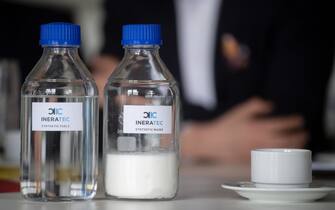 06 May 2019, Baden-Wuerttemberg, Eggenstein-Leopoldshafen: Two bottles containing synthetic fuel and synthetic wax from Ineratec GmbH are on one table at the Karlsruhe Institute of Technology (KIT). (to dpa-Story: "Magic Formula E-Fuels: How All Cars Could Become Climate Neutral" from 04.07.2019) Photo: Marijan Murat/dpa (Photo by Marijan Murat/picture alliance via Getty Images)