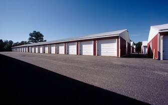 Daytime view of garage like rental storage units lined up in a row