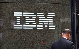 A businessman walks past the IBM building at 590 Madison Ave, New York in Midtown Manhattan.