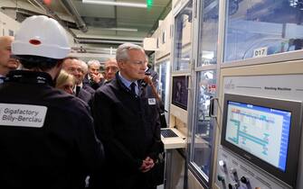epa10662805 French Finance Minister Bruno Le Maire (C) visits the gigafactory of Automotive Cells Company (ACC), a joint venture of Stellantis, TotalEnergies and Mercedes, during its inauguration in Billy-Berclau-Douvrin, northern France, 30 May 2023.  EPA/PASCAL ROSSIGNOL / POOL  MAXPPP OUT