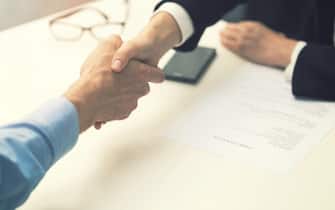 handshake after successful job interview at office