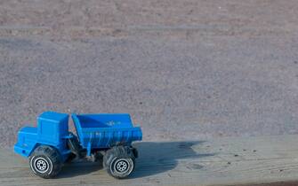 Toy blue construction dumper background