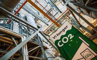 A banner reading "We Catch CO2" inside Amager Bakke, also known as Amager Slope or Copenhill, a combined heat and power waste-to-energy plant and recreational facility in Copenhagen, Denmark, on Friday, Sep. 15, 2023. The hulking, geometric wedge of silvery aluminum-and-glass paneling is one ofÂ the most technologically advanced waste-to-energy plants in the world. Photographer: Damian Lemaski/Bloomberg via Getty Images