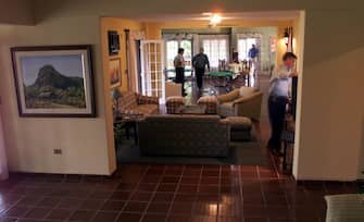 Men stand in a reception area of the residence that will house players for the upcoming Copa America matches 25 June 1999 in Asuncion.
Foto del aera de estar de la planta baja de la residencia de villa olimpia el 25 de Junio de 1999, en las afuera de Asuncion del Paraguay, donde se alojara durante la copa america el seleccionado argentino. La copa America-99 se disputara en cuatro ciudades paraguayas entre el 29 de Junio y el 18 de Julio de 1999 con la participacion de diez selecciones sudamericans, Mexico y Japon. (Photo by HORACIO VILLALOBOS / AFP) (Photo by HORACIO VILLALOBOS/AFP via Getty Images)