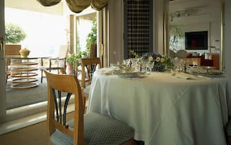 976230998 View of an organized dining table. (Photo by Quick Image/Construction Photography/Avalon/Getty Images)