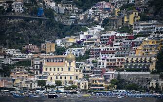 A view taken on July 1, 2020 shows the village of Positano on the Amalfi coast in southern Italy. - With its white and multicoloured houses perched on the mountainside about the crystalline waters of the Mediterranean, Italy's Amalfi coast is suffering from this year's lack of US tourists. (Photo by Filippo MONTEFORTE / AFP) (Photo by FILIPPO MONTEFORTE/AFP via Getty Images)