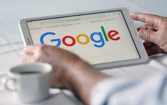 PARIS, FRANCE - SEPTEMBER 10: In this photo illustration, the Google logo is displayed on the screen of a tablet on September 10, 2019 in Paris, France. Yesterday in Washington, DC, fifty state attorneys general are joining together announced the launch of an antitrust investigation against the Google company, accused of dominating all aspects of advertising and Internet search. (Photo by Chesnot/Getty Images)