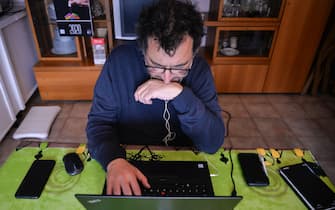 TURIN, ITALY - MARCH 23: A man works from home via smart working during the nationwide lockdown to control the coronavirus spread on March 23, 2020 in Turin, Italy. The Italian government continues to enforce the nationwide lockdown measures to control the spread of COVID-19. (Photo by Diego Puletto/Getty Images)