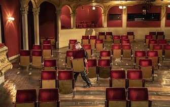 BERLIN, GERMANY - JUNE 03: An employee demonstrates removing of the chairs from the rows of seats in the auditorium of the Berliner Ensemble on June 03, 2020 in Berlin, Germany. Due to the contact restrictions during the corona pandemic, individual seats will be removed for future performances.  (Photo by Maja Hitij/Getty Images)
