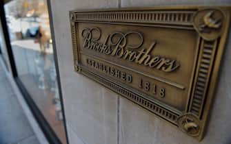 A sign on the Brooks Brothers store on Madison Avenue on the Upper East Side of Manhattan April 10, 2013 2013 in New York. AFP PHOTO/Stan HONDA        (Photo credit should read STAN HONDA/AFP via Getty Images)