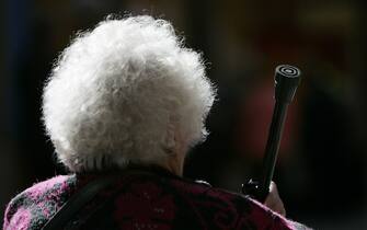 57645426 BLACKPOOL, UNITED KINGDOM - MAY 18: A senior citizen listen to the debates at the Fourteenth National Pensioners Parliament at Blackpool Winter Gardens on May 18 2006 in Blackpool, England. Over 2900 pensioners attended the parliament and debated many issues affecting Britain's senior citizens including abolition of council tax, free travel on public transport and calls for a state pension of GBP114 a week. (Photo by Christopher Furlong/Getty Images)