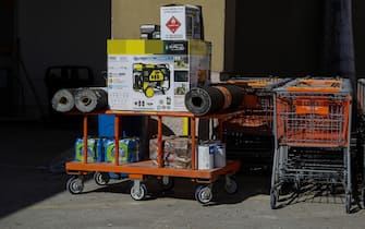 A cart with a portable generator and other supplies at a Home Depot store following Hurricane Ian in Cape Coral, Florida, US, on Friday, Sept. 30, 2022. Two million electricity customers in Florida remained without power Friday morning, according to the tracking site poweroutage.us. Photographer: Eva Marie Uzcategui/Bloomberg