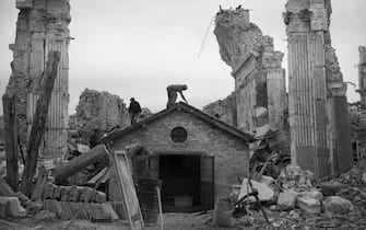April 1946:  A small makeshift church rises amongst the ruins of the Abbey of Monte Cassino near Naples, a Benedictine monastery dating back to 529 AD. The building was severly damaged when the Allied Army liberated the nearby town of Cassino from the Germans during World War II.  (Photo by Chris Ware/Keystone Features/Getty Images)