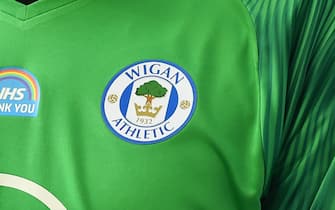 WIGAN, ENGLAND - JUNE 27: A detailed view of a 'Thank You NHS' logo on the shirt of a Wigan Athletic player during the Sky Bet Championship match between Wigan Athletic and Blackburn Rovers at DW Stadium on June 27, 2020 in Wigan, England. (Photo by Nathan Stirk/Getty Images)