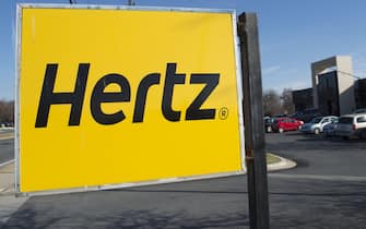 A Hertz car rental logo is seen in Landover Hills, Maryland, December 31, 2014. AFP PHOTO / SAUL LOEB        (Photo credit should read SAUL LOEB/AFP via Getty Images)