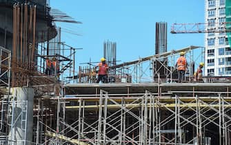 Labourers work at a construction site of a new apartment building in Colombo on June 3, 2020. (Photo by Ishara S. KODIKARA / AFP) (Photo by ISHARA S. KODIKARA/AFP via Getty Images)