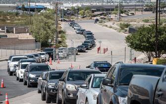 EL PASO, TX - JULY 21: People wait in their cars at a newly opened mega drive-thru site at SISD Student Activities Complex on July 21, 2020 in El Paso, Texas. As coronavirus deaths surge past 4000 in Texas, overwhelmed hospitals are being forced to plan for extra refrigerated storage to hold deceased patients. (Photo by Cengiz Yar/Getty Images)