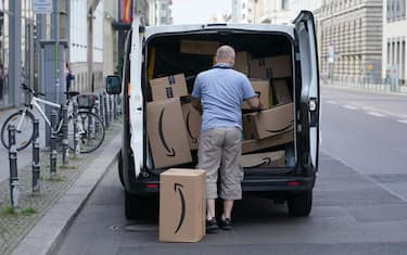 BERLIN, GERMANY - JUNE 18: A courier unloads Amazon packages during a delivery on June 18, 2020 in Berlin, Germany. Amazon has expanded rapidly in Germany and now has at least 13 Amazon warehouses nationwide. (Photo by Sean Gallup/Getty Images)