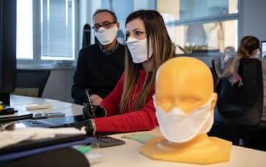 VERANO BRIANZA, ITALY - MARCH 25: Two designers use a CAD software to design a protective face mask at Cifra production plant on March 25, 2020 in Verano Brianza, near Milan, Italy. Cifra is a manufacturing company producing garments for leading global fashion brands. Following the novel Coronavirus outbreak in Italy, Cifra has converted its industrial activities to patent and produce a high-tech, double layered and water-repellent protective face mask for civil use, called WARP-MASK. (Photo by Emanuele Cremaschi/Getty Images)