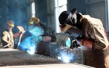 This photo taken on May 3, 2018 shows a worker cutting steel at a factory in Huaibei in China's eastern Anhui province. - China's surplus with the United States widened in April, underlining an imbalance between the economic titans as they struggle to reach an agreement on averting a potentially damaging trade war. (Photo by - / AFP) / China OUT        (Photo credit should read -/AFP via Getty Images)