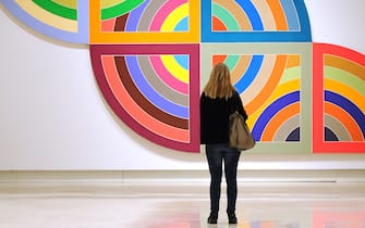 A visitor looks at Haran II by US artist Frank Stella belonging to the Guggenheim foundation, as part as an exhibition called "Guggenheim Collection: The American Avant-Garde 1945-1980" on February 6, 2012   at the Palazzo delle Esposizioni in Rome. The exhibition, running from February 7 to May 6, showcases more than 60 exemplary works produced during the decades after World War II from the Guggenheim museum's permanent collection. AFP PHOTO / GABRIEL BOUYS (Photo credit should read GABRIEL BOUYS/AFP via Getty Images)