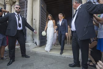 VENICE, ITALY - JULY 12:  Bastian Schweinsteiger and Ana Ivanovic come out of the wedding hall at Palazzo Cavalli after the celebration of their marriage on July 12, 2016 in Venice, Italy.  (Photo by Awakening/Getty Images)