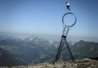 Swiss acrobat Ramon Kathriner performs with the Wheel Of The Death during the Glacier 3000 Air show an event marking the reopening of the Alpine facilities on June 23, 2020 above Les Diablerets following the lockdown due to the COVID-19 outbreak, caused by the novel coronavirus. (Photo by Fabrice COFFRINI / AFP) (Photo by FABRICE COFFRINI/AFP via Getty Images)