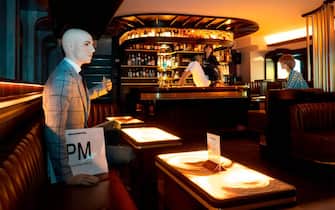 Mannequins are placed around a bar in Vienna, Austria to help customers keep the social distancing rules on May 15, 2020 as Austria reopened all cafes and restaurants taking a further step towards ending lockdown measures brought in to tackle the new coronavirus COVID-19 pandemic. (Photo by JOE KLAMAR / AFP) (Photo by JOE KLAMAR/AFP via Getty Images)