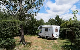 GARGANTILLA DE LOZOYA, SPAIN - JUNE 13: A motorhome is seen at the Monte Holiday campsite on June 13, 2020 in Gargantilla de Lozoya y Pinilla de Buitrago, Spain. The campsite, which had to close during the country's months-long coronavirus lockdown, has a capacity for 1,200 people and is completely booked for every weekend from mid-July through August. They have an average of 4,000 daily visits on the web and are seeing a large increase in people who come with motorhomes. (Photo by Carlos Alvarez/Getty Images)