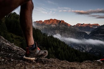 An ultra trailer walks near Chamonix as he competes on September 2, 2018, in the 170 km Mount Blanc Ultra Trail (UTMB) race around the Mont-Blanc, crossing France, Italy and Switzerland. - The 16 th Ultra-Trail du Mont-Blanc (UTMB), a mountain ultramarathon with numerous passages in high altitude (>2500m) and in difficult weather conditions (night, wind, cold, rain or snow), takes place once a year in the Alps, across France, Italy and Switzerland. (Photo by JEFF PACHOUD / AFP)        (Photo credit should read JEFF PACHOUD/AFP via Getty Images)